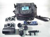 Lot of 2 Olympus OM1N / OM10 Cameras & Accessories
Lot of camera equipment including:
- 2 Olympus 35mm camera bodies, model OM1N and OM10
- One 35mm Olympus lens
- One macro 50mm lens
- One auto zoom 75 - 150mm lens
- Miscellaneous camera equipment including a neck strap and Vivitar Auto Thrystor 225 flash bulb
-One large Tamrac camera bag. 
ZB4623