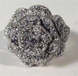 Jewelry Sterling Silver Rose Fashion Ring
Beautiful sterling silver fashion ring with rose flower design. Accented with several sparkly clear CZ stones and a round prong set pink colored gemstone. Marked "925 China CZ", ring size: 8.25. Total weight: .26 ozt. 
ZB1341