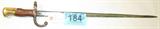 Firearm Antique French 1874 "Gras" Sword Bayonet
Antique French Model 1874 "Gras" Sword Bayonet. This bayonet was the last of the French "sword-type" bayonets. It was manufactured to fit the French Model 1874 "Gras" Infantry Rifle. The "Gras" was manufactured from 1874 to about 1885 in St. Etienne, FR. This bayonet has a solid brass pommel with integral latching mechanism (push-button/spring-steel). Grips are wood. Crossguard is steel, usually "blued," with upper guard being the muzzle-ring, lower guard forming a hooked "blade-breaker" quillon. Blades are steel - well made - and triangular (3-edge) in form (very sturdy as a thrusting weapon). The blade is marked "Mre d' Armes de St. Etienne 1878".
Tag Word: Firearm, Gun, Antique, Militaria

Z12