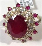 Jewelry 14K Yellow Gold Ruby & Diamond Ring GLA
Breathtakingly beautiful 14K yellow gold ruby & diamond ring. Included Gemological Laboratory of America (GLA) Premiere Appraisal reads:
"One lady's polished, stamped and electronically tested solid 14K yellow gold ring with: 1 Genuine Ruby (Corundum), 12 Genuine Ruby (Corundum)s and 12 Genuine Round Full Diamonds. This item weighs 7.40 grams and fits a finger size 8.00. The setting measures 23.39 mm and the band measures 1.55mm graduating up to 2.49mm at the center of the shank. The condition is BRAND NEW. The gemstones have been analyzed in the mounting. 
MAIN GEMSTONE
Identity: Genuine Ruby (Corundum)
Shape: Oval (Faceted)
Measurements: 13.10 x 11.14 x 6.92mm (est)
Quantity: 1
Carat Weight: (See Below)
Clarity Type: II = may include eye-visible features
Hue: Purplish Red
Transparency: Translucent
Tone: Dark
Quality: 5 - Good
ADJACENT GEMSTONES
Identity: Genuine Ruby (Corundum
Shape: Round (Faceted)
Measurements: 2.32mm (no depth
Quanti