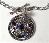 Jewelry Sterling Silver Gemstone Necklace
Gorgeous sterling silver fashion necklace featuring a round pendant decorated with several prong set multicolored gemstones in many different shapes. Necklace has ring and bar style clasp. Marked "925 Thailand", measures: 17" long. Total weight: .40 ozt. 
ZB1341