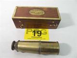 Vintage Thomas J Evans Telescope & Original Box
A vintage, pirate like, collapsible telescope which appears to be solid brass. The wooden case has a hinged top lid with brass accents, is felt lined, and appears to have the original latches on the front. The telescope and box are both marked "Thos. J. Evans, London". Telescope extends to over 16". The box measures 2.25" tall x 6.25" across x 2.5" in depth.
ZB4623