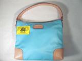 Kate Spade New York Designer Purse / Hand Bag
Nice Kate Spade New York purse in teal blue & tan. Looks to be in great condition. Consignor stated that it is an original bag and not a copy. Has two open slots & a zipper pouch on the inside of the purse, single strap, measures 12.5" tall / deep x 9.5" wide. 
Z989