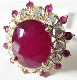 Jewelry 14K Yellow Gold Ruby & Diamond Ring GLA
Magnificent 14K yellow gold ruby & diamond ring. Included Gemological Laboratory of America (GLA) Premiere Appraisal Report reads:
"One lady's polished stamped & electronically tested solid 14K yellow gold ring mounted with: 1 Genuine Ruby (Corundum) 12 Genuine Rubies (Corundum) and 12 Genuine Round Full Diamonds. This item weighs 7.10 grams and fits a finger size 8.25. The setting measures 23.62 x 22.53 mm and the band measures 1.42mm graduating up to 2.09mm at the center of the shank. The condition is BRAND NEW. The gemstones have been analyzed in the mounting. 
MAIN GEMSTONE:
Identity: Genuine Ruby (Corundum)
Shape: Oval (Faceted)
Measurements: 13.36 x 10.90 x 6.80mm (est). 
Quantity: 1 
Carat weight: (See Below)
Clarity Type: II = may include eye visible features.
Hue: Cabernet Red
Transparency: Translucent
Tone: Dark
Quality: 6 - Good to Very Good
ADJACENT GEMSTONES
Identity: Genuine Ruby (Corundum)
Shape: Round (faceted)
Measurement