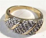 Jewelry 14kt Yellow Gold Diamond Ring
Lovely 14kt yellow gold fashion ring featuring several small round diamond stones. Marked "14k", ring size: 5. Total weight: 2.2 dwt. 
ZB4408