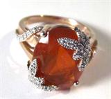 Jewelry 14kt Gold Dragonfly Fire Opal Fashion Ring
Gorgeous 14kt yellow gold fashion ring featuring a large orange colored fire Opal gemstone with dragonfly designs around stone. Dragonflies are accented with small diamond stones. Consignor states: 6.5 carat natural fire opal; .15 ctw diamonds. Marked "14k TAL", ring size: 8.25. Total weight: 4.5 dwt. 
ZB1341