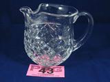 Waterford Cut Crystal Beverage Pitcher Signed
A small yet elegant beverage / juice pitcher. A beautiful vine like pattern accents the top just under the ice spout and the bottom features the classic diamond cut pattern. Signed Waterford beneath the handle. Measures 5.75" tall with a 5" diameter.
ZB5022