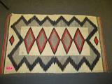 Southwestern Style Navajo Hand Woven Wool Rug
An old hand woven Native American Indian, believed to be Navajo, southwestern style wool rug. Rug features a bold diamond pattern in using reds, blacks, brown and beige colors. Measures 55" x 35".
ZB152