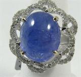 Jewelry 18K White Gold Tanzanite Diamond Ring GLA
Breathtaking 18K white gold, Tanzanite & diamond ring. Included Gemological Laboratory of America (GLA) Premium Appraisal reads: 
"One lady's polished, stamped & electronically tested solid 18K white gold ring mounted with: 1 Genuine Tanzanite (Zoisite) and 85 genuine round full diamonds. This item weighs 10.40 grams and fits a finger size 7.25. The setting measures 24.25 x 21.81 mm and the band measures 5.98 mm tapering down to 2.59 mm at the center of the shank. The condition is BRAND NEW. The gemstones have been analyzed in the mounting. 
MAIN GEMSTONE
Identity: Genuine Tanzanite (Zoisite)
Shape: Oval (Cabochon)
Measurements: 15.07 x 12.19 x 7.90mm (estimate)
Quantity: 1
Carat weight: 12.43 cts (estimate)
Clarity Type: I = variety flawless - near flawless
Hue: Violet Blue
Transparency: Semi Transparent
Tone: Medium
Saturation: Fair - Moderate
Polish: 6 - Good - Very Good
Finish: 7 - Very Good
Quality: 6 - Good to Very Good
Adjacent G