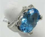 Jewelry 14kt White Gold Blue Topaz Fashion Ring*
Gorgeous 14kt white gold cocktail ring featuring a large oval shaped, faceted, prong set blue topaz stone. Band is accented with several round diamonds. Ring size: 4.75, total weight: 7.1 dwt. 
*Reserve Item
ZB4858