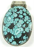 Jewelry Large Sterling & Turquoise Pendant
Gorgeous sterling silver pendant featuring a massive, oval shaped, polished, vibrant blue, speckled turquoise stone. Sterling bezel has lovely design. Marked "925", measures: 3.5" long x 2" wide. Total weight: 3.20 ozt.