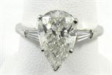 Jewelry GIA 2.83 Carat Pear Diamond Platinum Ring*
Exquisite platinum diamond engagement ring featuring a large prong set pear brilliant cut diamond, as well as 2 baguette cut diamonds. Ring is marked: 900 Plat, size: 9. Total weight: 3.0 dwt. Included Diamond Grading Report from Gemological Institute of America reads: "Diamond Grading report, April 23, 2012 
Laser Inscription registry: GIA 2141640459
Shape and cutting style: Pear Brilliant
Measurements: 11.39 x 7.46 x 5.22 mm
Carat weight: 2.83 carat
Color grade: I
Clarity grade: SI2
Finish
Polish: Very good
Symmetry: Good
Fluorescence: Faint
Comments: Clouds, pinpoints and surface graining are not shown."
*Reserve Item
ZB4858