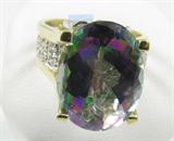 Jewelry 14K Yellow Gold Mystic Topaz Diamond Ring
Magnificent 14K yellow gold ladies fashion / cocktail ring, featuring a large mystic topaz stone, oval, faceted, in a prong setting that is highly elevated from the band, with many small diamonds in individual bezel settings flush with the band, positioned underneath the featured gemstone as well as at the shoulders. This arrangements of diamonds makes the featured gemstone appear incredibly sparkly. A lovely addition to your jewelry collection. Marked / signed "14K", ring size: 6.5. Total weight: 5.8 dwt
ZB4858