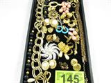 Jewelry Mixed Lot Costume Monet Avon Napier &More
Mixed lot of fabulous ladies' costume / fashion jewelry. Some of the pieces in this lot are signed. A sampling includes:
- Beautiful pierced dangling earrings, each featuring a white faux pearl, secured to a gold toned anchor, which is attached to a gold tone button style embellishment shaped like a blooming flower. Marked / signed "Avon", measures 2" long.
- Elegant beaded black & gold tone necklace, smooth beads graduating / varying in size in a single strand, lobster claw clasp, marked / signed "Monet", measures 17.25" long.
- Gorgeous floral brooch, gold toned, featuring several small white iridescent stones, possibly pearls, arranged in a floral design. Marked / signed "Perle". Measures 2" across.
- Lovely textured hoop style earrings, gold tone, marked / signed "Monet".
- Gorgeous gold toned button style pierced post earrings, marked / signed "Napier".
- Beautiful hat / lapel pin, gold toned with a sparkling white / colorless
