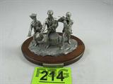 Danbury Mint Pewter& Wood "Spirit of '76" Figurine
Fantastic pewter & wooden figurine / statue titled "Spirit of '76. Depicts three soldier musicians, two drummers and a flutist / flute player, possibly a reference to the Colonial period / Revolutionary War. Great details, figures are made of pewter, standing on a wooden platform. Marked / signed "Designed and Produced Exclusively for The Danbury Mint". Measures 5.5" tall and 7.25" wide.
ZB5104