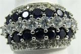 Jewelry Sterling Silver Blue Sapphire & CZ Ring
Gorgeous sterling silver fashion ring featuring sixteen prong set, round, faceted blue gemstones, possibly sapphires accented with many round cut Cubic Zirconia stones. Marked "925", ring size: 8.75. Total weight: .24 ozt.
#2447-9011