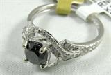 Jewelry 18KT White Gold Black Diamond Ring
Lovely 18KT white gold black diamond ring, Size: 7. Included Gemological Laboratory of America Inc. (GLA) Premium Appraisal reads:
"One lady's polished, stamped and electronically tested solid 18K white gold ring mounted with: 1 Genuine Round Black Diamond and 56 Genuine Round Full Diamonds. This item weighs 2.89 grams and fits a finger size 7.00. The setting measures 11.52 x 10.42 mm and the band measures 3.52 mm tapering down to 1.97 mm at the center of the shank. The condition is BRAND NEW. The gemstones have been analyzed in the mounting.
MAIN GEMSTONE:
Identity: Genuine Black Diamond
Cut: Round (faceted)
Measurements: 5.58 x 3.70 mm
Quantity: 1
Carat Weight: 0.75 ct (est.)
Clarity Grade: Opaque
Color Grade: Black
MAIN GEMSTONE:
Identity: Genuine Diamond
Cut: Round Full (faceted)
Measurements: 1.00 mm (no depth) (average)
Quantity: 56
Carat Weight: 0.34 ctw (est.)
Clarity Grade: I-1
Color Grade: G
Cut Grade: 5-Good
Diamond C