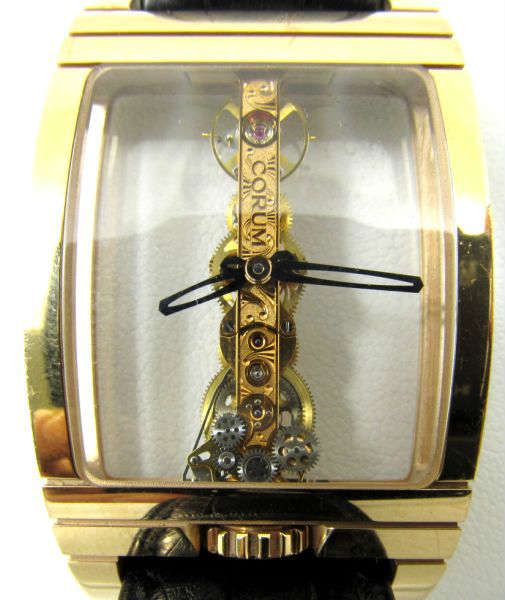 Jewelry 18kt Gold Corum Golden Bridge Watch Rousso
Stunning and exquisite 18kt rose gold Corum "Golden Bridge" watch with clear face viewing the intricacy of the gears and movement. This fabulous timepiece was presented to the world famous poker player Vanessa Rousso, who has presented it to us for sale. Vanessa states, "This watch was given to me by Corum Swiss Timepieces in 2008 as part of a sponsorship deal I had with them to promote their timepieces between 2007 and 2008. Watch comes with original display box, all the original paperwork, and gloves for handling. Marked "Corum 18k 750 Swiss Made", total weight: 57.1 dwt.
Certificate reads: "In celebration of Corum's 50th Anniversary, this timepiece is a new rendition of a revolutionary concept introduced 25 years ago and now brought back to life, the world-renowned Golden Bridge. Originally created in 1980, the new Golden Bridge is a modern interpretation of this iconic classic with an entirely re-engineered movement that perfectly 