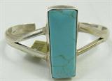 Jewelry Sterling Silver Turquoise Cuff Bracelet
Gorgeous sterling silver cuff bracelet featuring a large narrow rectangular shaped turquoise stone, measures: 1.5" long. Marked "925 Mexico", measures: 5.25" wide with 1.25" opening. Total weight: 1.19 ozt.