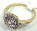 Jewelry 14KT Rose Gold Amethyst Ring
Lovely 14KT rose gold fashion ring. Faceted purple amethyst stone, cushion cut style. Accented with small square cut diamonds. Marked "14KT", ring size: 7. Total weight: 1.6 dwt.