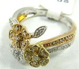 Jewelry 14KT Tri-Gold Diamond Ring
Stunning 14KT tri colored gold fashion ring. Featuring a yellow gold, white gold & rose gold flower, accented with small round diamonds. Marked "14KT", ring size: 7. Total weight: 3.3 dwt.