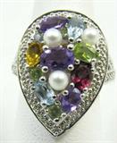 Jewelry Sterling Silver Multicolored Gemstone Ring
Gorgeous sterling silver fashion ring featuring cultured pearls, amethyst, peridot, garnet, citrine and aqua marine gemstones. Marked "925", ring size: 7.5. Total weight: .24 ozt.