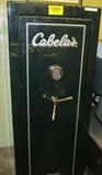 Firearm Cabelas's 15 Gun Safe - Used
Cabelas's 15 Gun Safe. The safe is configured for 15 long guns with a top self for a few handguns. Interior is carpeted, has individual slots for barrels, and hole at both ends of top shelf for longer guns. Outer color is green Measures 23.5"W x 21"D x 60"H. The exterior has scratches on the outside. Used.