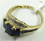 Jewelry 14KT Yellow Gold Sapphire & Diamond Ring
Ravishing 14KT yellow gold fashion ring featuring three, rectangular cut, blue sapphires in a tiered step up design. Stones are accented with small diamonds and small sapphires in channel setting. Marked "14KT", ring size: 6.5. Total Weight: 1.7 dwt.