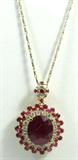 Jewelry 14kt Yellow Gold Ruby & Diamond Necklace
Stunning 14KT yellow gold, ruby & diamond necklace. Included AIG (American International Gemologists) Pre-Sale Report reads:
"One electronically tested 14KT yellow gold ladies cast & assembled ruby & diamond pendant with chain. Condition is new, good workmanship. The pendant features a ruby set within a tiered cluster of rubies and diamonds, completed by a ruby and diamond set yellow gold bail. The pendant is supported by a two toned eighteen in 14KT white and yellow gold designer style chain terminating in a lobster claw clasp. Bright polish finish. Identified with markings of "14K". Containing: One Prong set oval mixed cut natural ruby, measuring 16.75 x 14.60 x 9.22mm, approximate weight of 18.12ct. with a strong red fluorescence, clarity is heavily included, type II, dark, moderately strong, slightly purplish red color, (GIA slpR 7/4), cut is good. Transmitting light somewhat diffusely, transparent to translucent. Naturally occurring