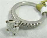 Jewelry 18K White Gold Diamond Ring AIG*
Breathtaking 18K white gold diamond ring, size 6.75. Included American International Gemologists (AIG) Pre-Sale Gemological Report reads:
"One electronically tested 18KT white gold ladies cast diamond ring with a bright polish finish. Condition is new, good workmanship. The featured diamond is supported by diamond set shoulders and completed by a two millimeter wide band. Identified with markings of "750". Containing:
One prong set round brilliant cut diamond, measuring 6.80-6.75 x 4.07mm (depth est.) approximate weight of 1.31ct with a strong blue fluorescence. Graded in the setting.
Clarity: I-2
Color: G
Depth: 60.0%
Table: 57.5%
Twelve prong set round brilliant cut diamonds, measuring 1.60-1.50 x 0.93mm (depth estimate) approximate total weight of 12 stones = 0.23 ct. Graded in the setting.
Clarity: SI-2 to I-1
Color: F-H
Total weight of diamonds: 1.54ct. .
Total weight of ring: 3.90 gm."
*Reserve Item