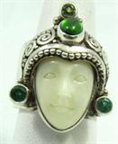 Jewelry Sterling White Onyx Emerald & Peridot Ring
This lot contains a gorgeous eastern style, possibly Hindi, sterling silver ring. Features a carved white Onyx stone carved like a face, with a silver headdress with inlaid emerald and cab Peridot, a mixture of smooth / cabochon style and round faceted cuts. Marked / signed "Bajen 925". Fits a finger size 7.25.
Total weight: 0.62 ozt