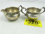 Sterling Silver Gorham Creamer and Sugar
Gorgeous sterling silver creamer and sugar made by Gorham sterling. Unknown filigree style pattern, marked "Gorham sterling 1133". Each piece has a few small dents. Measures: 2.5" tall, total weight: 5.64 ozt.
Tag word: Sterl925