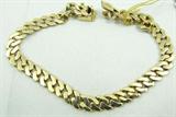 Jewelry 14kt Yellow Gold Curb Style Chain Bracelet
Stately 14kt yellow gold thick curb style chain bracelet. Marked "14k", with unknown maker mark. Measures: 8.25" long. Total weight: 15.5 dwt.