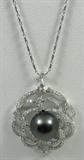 Jewelry Tahitian Cultured Pearls
Fabulous Tahitian Cultured Pearls. Included American International Gemologists (AIG) Pre-Sale Gemological Report reads:
"One electronically tested 14KT white gold ladies cast & assembled Tahitian cultured pearl and diamond pendant with chain. Condition is new, good workmanship. The pendant features a Tahitian cultured pearl set within a diamond bezel, completed by a white gold floral bail. Eighteen inch length 14KT white gold designer style chain terminating in a lobster claw clasp. Bright polish finish. Trademark is Orianne. Identified with markings of "14K". Containing:
One black Tahitian cultured pearl, 12.5mm in size. The pearl is black in color and exhibiting orient with a high luster, thick nacre, mostly round, lightly spotted Graded in the setting.
Tahitian cultured pearls from in the large "Black Lipped" Pinctada Margaritifera oyster, which is about twice the size of the Japanese Akoya oyster. This warm water species from across the central and