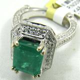 Jewelry 18KT White Gold & Emerald Diamond Ring
Beautiful 14KT White Gold & Emerald Diamond Ring, size 6.25. Included American International Gemologists (AIG) Pre-Sale Estimated Retail & Gemological Report reads:
"One electronically tested 18KT white gold ladies cast emerald and diamond ring. Condition is new, good workmanship. Featuring an emerald set within a diamond bezel, supported by an elaborate white gold and diamond gallery, diamond ribbons and diamond shoulders, completed by a three millimeter wide band. Trademark is HANA. Identified with markings of "18K". Containing:
One prong set rectangular step cut natural emerald, measuring 9.10 x 7.50 x 4.88mm, approximate weight of 2.63ct., clarity is heavily included, type III, medium dark, very slightly grayish, bluish green color, (GIA bG 6/3), cut is good. Transmitting light with somewhat diffusely, transparent to translucent. Naturally occurring internal & external characteristics are present. Indications of oil & opticon residue.