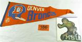 Mixed Lot Vintage MSU & Denver Bronco Felt
A great lot of vintage football souvenirs. Would make a great gift for a collector. Lot includes:
- A felt uniform or jacket patch with the letters "MSU". Appears to be a bulldog, the Mississippi State University mascot. Patch measures 7.5" x 7".
- A 1967 Denver Broncos felt pennant / flag. Has signs of wear from age and use. Measures approximately 28" long.