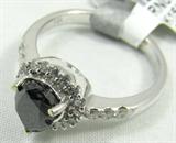 Jewelry 14KT White Gold Black Diamond Ring
Beautiful 14KT white gold & diamond ring, size: 7. Included Gemological Laboratory of America (GLA) premium appraisal reads:
"One lady's polished, stamped and electronically tested solid 14k white gold ring mounted with: 1 Genuine Pear Black Diamond, 24 Genuine Round Full Diamonds. This item weighs 4.10 grams and fits a finger size 7.00. The setting measures 10.43 x 9.96 mm and the band measures 1.96 mm graduating up to 2.57 mm at the center of the shank. The condition is BRAND NEW. The gemstones have been analyzed in the mounting.
MAIN GEMSTONE:
Identity: Genuine Black Diamond
Cut: Pear (faceted)
Measurements: 7.18 x 5.60 x 3.84 mm
Quantity: 1
Carat Weight: 1.18 ct (est)
Clarity Grade: Opaque
Color Grade: Black
Cut grade: 6- Very Good-Good
ADJACENT GEMSTONE:
Identity: Genuine Diamond
Cut: Round Full (faceted)
Measurements: 1.90-1.20 mm (est) (no depth)
Quantity: 24
Carat Weight: 0.36 ctw (est)
Clarity Grade: SI- 1/SI-2
Color Grade: G-(Average