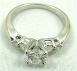 Jewelry 14kt White Gold 1 Carat + Diamond Ring*
Exquisite 14kt white gold engagement ring featuring a large 1 carat prong set diamond and four smaller diamonds. Included Labtrade Gemological Laboratory report reads: "One stamped 14kt white gold engagement ring. Containing: One round brilliant cut diamond approximate weight of 1.08cts. Clarity SI-2 Color H. Four round brilliant cut diamonds approximate total weight of 0.27cts. Clarity VS1-VS2 Color G-H. Total weight of ring 3.95gm". Ring size: 6.5, total weight: 2.5 dwt.
*Reserve Item