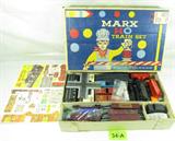 Vintage Marx HO Train #74642 Set Plus Some!
This vintage Marx train set #74642 appears to come with the complete train set and some additional pieces, including a 1974 AHM Hillbilly Mini-structure set of scale cut out buildings. Trains and box do show some wear due to age and use. Don't miss out on this treasure trove of trains and accessories!