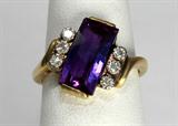 Jewelry 14kt Yellow Gold Amethyst & Diamond Ring
Lovely 14kt yellow gold fashion ring featuring a large amethyst and six round diamonds. Included Labtrade Gemological Laboratory report reads: "One stamped 14kt yellow gold lady's ring. Containing: One fantasy rectangular cut natural amethyst approximate weight of 2.55cts. Six round single cut diamonds approximate total weight of 0.10cts. Clarity VS-1 to SI-1 Color H-I. Total weight of ring 3.64gm". Ring size: 5.5, total weight: 2.3 dwt.