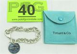 Jewelry Tiffany & Company Tag Charm Bracelet
Gorgeous sterling silver Tiffany & Co. Return to Tiffany round tag charm bracelet. Marked "925", consignor states this is a genuine Tiffany & Company piece. Comes with suede Tiffany pouch. Measures: 7.5" long. Total weight: 1.13 ozt.