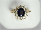 Jewelry 14k Yellow Gold Sapphire & Diamond Ring
Elegant 14kt yellow gold ring featuring a large blue sapphire stone surrounded by diamonds. Included Labtrade Gemological Laboratory report reads: "One stamped 14kt yellow gold lady's ring. Containing: One oval shape natural blue sapphire approximate weight of 1.10cts. Twelve brilliant cut diamonds approximate total weight of 0.48cts. Clarity SI-1 to SI-2 Color G-H. Weight of ring 4.23gm." Ring size: 2.25 with spacers, total weight: 2.7 dwt.