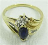 Jewelry 10kt Yellow Gold Sapphire & Diamond Ring
Beautiful 10kt yellow gold fashion ring featuring a prong set, marquis shaped blue sapphire stone, accented with small diamonds. Marked "10k", ring size: 7.5. Total weight: 1.8 dwt.