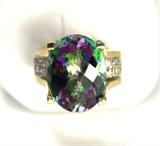 Jewelry 14kt Yellow Gold Mystic Topaz Diamond Ring
Fabulous 14kt yellow gold ring featuring a colorful Mystic Topaz stone and several diamonds. Included Labtrade Gemological Laboratory report reads: "One Stamped 14kt yellow gold lady's ring. Containing: One oval checkerboard cut natural mystic topaz approximate weight of 13.50cts. Thirty-one pave' set round brilliant cut diamonds approximate total weight of 1.00 cts. Clarity SI-1 to I-1 Color J-K. Total weight of ring 8.92 gm". Ring size: 6.25, total weight: 5.7 dwt.