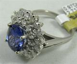 Jewelry 14K White Gold Tanzanite Ring
Ravishing 14K white gold & Tanzanite ring, Size: 6.5. Included American International Gemologists (AIG) Pre-Sale Gemological Report reads:
"One electronically tested 14kt white gold ladies cast Tanzanite and diamond ring with a bright polish finish. Condition is new, good workmanship. The featured diamond is set within a two tiered diamond lattice gallery, supported by diamond split shoulders and completed by a two millimeter wide band. identified with the markings of "14k". Containing:
One prong set oval mixed cut natural tanzanite, measuring 9.35 x 7.39 x 5.60mm, approximate weight of 2.71ct., clarity is eye clean, type I, medium, very slightly grayish, bluish violet color, (GIA vB 5/3) to medium, very slightly grayish, purple, (GIA P 5/3), cut is good. Transmitting light with no distortion, transparent. The stone displays 40% extinction. Graded in the setting.
Tanzanite is a very rare gemstone that is only found in the country of Tanzania. Origi