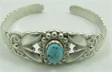 Jewelry Sterling Silver & Turquoise Cuff Bracelet
Beautiful sterling silver cuff bracelet with lovely metal work design decorated with an oval shaped turquoise stone. Marked "sterling", measures: 5.5" wide with .75" opening. Total weight: .66 ozt.