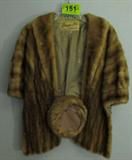 Vintage Designer Fur Stole & Hat
A vintage designer fur stole and hat, possibly mink.
- A pill box style hat with label "Designed by Lora". The hat measures 7" across opening. No rips or tears.
- A one-size fits all stole with a Henrietta Stein, Harrisburg label. The lining and inside pockets appear to be hand stitched. The lining has been monogrammed with the initials "EFH". A 5" x 7" vintage photograph is located in one of the inside pockets and features a formal wedding scene in which a woman appears to be wearing this stole. There are no dates or names written on the photograph. The lining of the stole has some minor fraying but there are no holes, rips or tears in the fur.