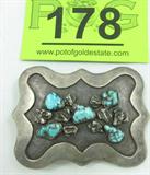 Jewelry Sterling Silver Turquoise Belt Buckle
Awesome Southwestern style sterling silver belt buckle with turquoise nuggets. Marked / signed "AC Sterling", measures: 3.75" wide x 2.25" tall. Total weight: 2.88 ozt.
