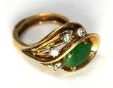 Jewelry 14kt Yellow Gold Jade & Diamond Ring
Fabulous vintage 14kt yellow gold jade and diamond cocktail ring. Included Labtrade Gemological Laboratory report reads: "One stamped 14kt yellow gold lady's ring. Containing: One oval shaped natural Jade approximate weight of 1.00cts. Four round brilliant cut diamonds approximate total weight of 0.25cts. Clarity SI-2 to I-1 Color I-J. Total weight of ring 7.23gm". Ring size: 5.75, total weight: 4.7 dwt.