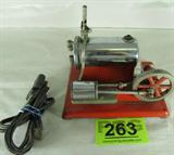 Vintage Empire metal toy steam engine electric educational toy. Consignor states it is in working condition. Electrical plug is included. Base does have chips in the paint and some rust on the base and body. A perfect addition to your collection.